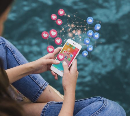 high-angle-woman-holding-smartphone