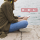 side-view-woman-sitting-pier-using-social-media-application-mobile-phone